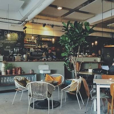Café interior with tables and a service counter